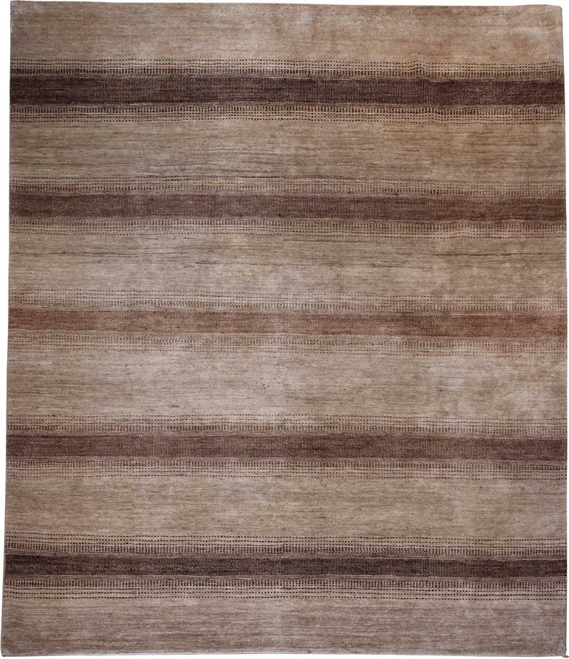 Urban Nature Oaked Path vloerkleed in bruin-beige van Koreman Exclusive Carpets, handgeknoopt uit wol.